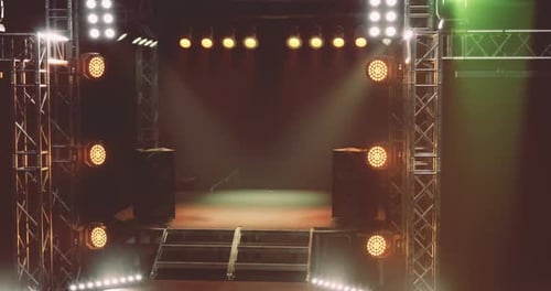 Concert Stage Set with Colorful Lights and Sound Equipment Ready