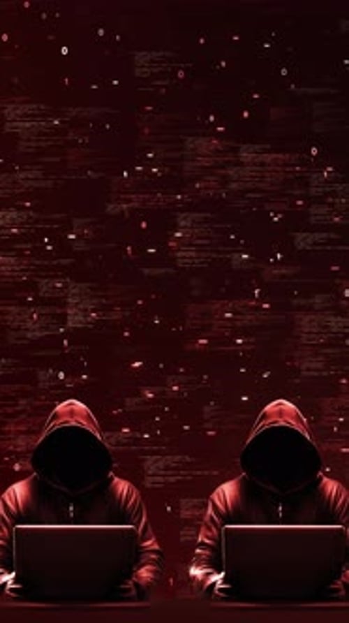 Anonymous Hackers in Hoodies with Red Digital Code Silhouettes Working on Laptops Against a