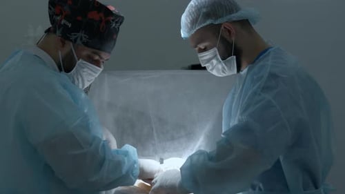 Surgeons during medical procedure, treatment concept
