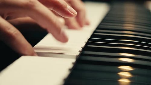 Woman's Hands Playing Beautiful Piano Music