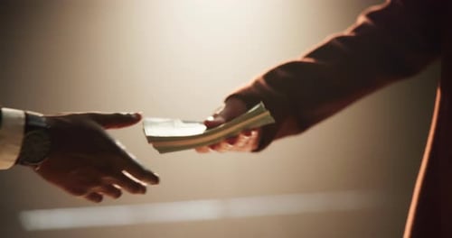 Money Exchange in Dark, Moody Lighting