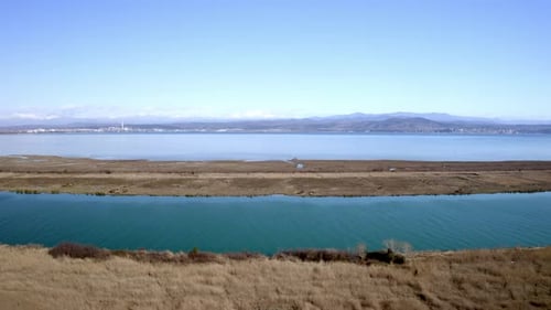 drone panorama of a lagoon near trieste with a beautiful reflection