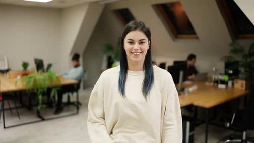 Smiling Modern Girl Standing at Modern Office Coworking Space