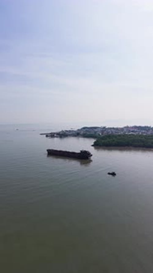 Aerial (Vertical ) View of a Ship and a Boat Near the Coast in Vietnam.