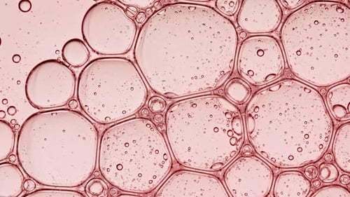 Macro View of Interconnected Bubbles with Red Hue