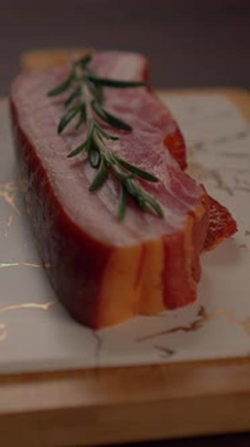 An Elegant Presentation of Cured Meat Artistsically Arranged on a Decorative Plate