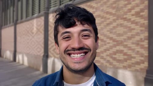 Smiling Young Man Close Up in Urban Setting