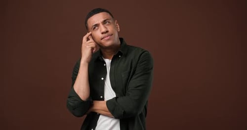 Man Thinking Deeply in Studio Setting