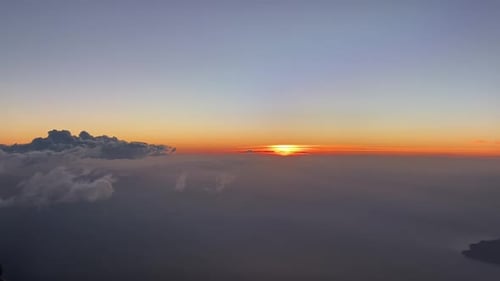 Dawn from a plane doing a left turn
