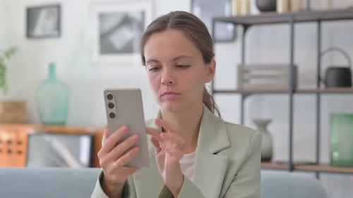 Portrait of Young Businesswoman Criticizing Online Loss in Creative Office