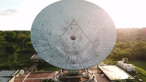 Satellite dishes at the sunset in a radio station in the middle of the woods