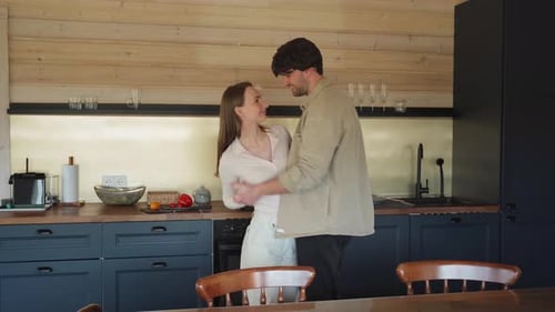 Couple Dancing Romantically in the Kitchen