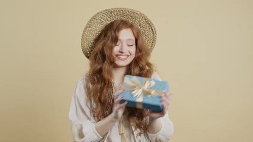 Young Woman Admires a Birthday Gift