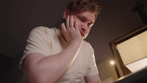 Man Working and Answering a Call at Night