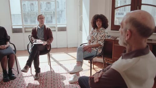 Group Therapy Session with Participants Indoors