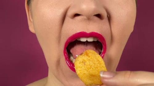 Woman with Red Lips Eating Potato Chip