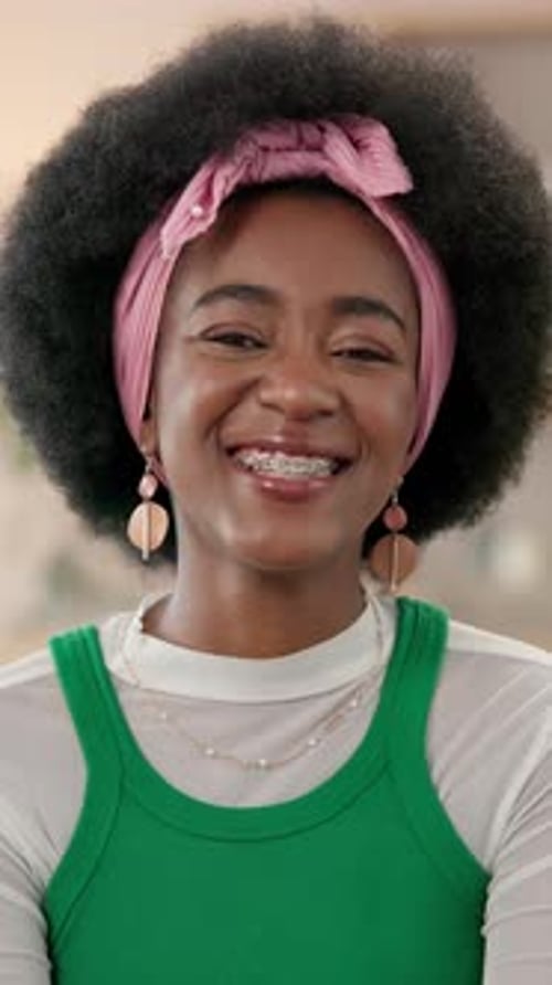Smiling Young Woman in Green Tank Top