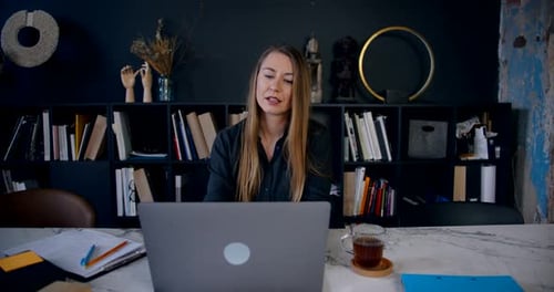 Zoom in Portrait of Young Beautiful Blonde Business Woman Using Laptop to Work Online From Home on