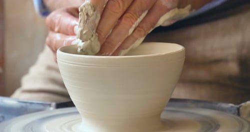 close up of old craftsman handmade clay and mold to create home-made jars and artwork. Concept of: