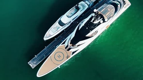 60 fps Drone slow mo Miami super yachts at marina hug yacht midday heli pad epic