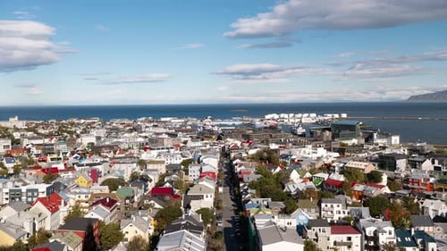 Time lapse of the skyline of downtown Reykjavik, Iceland, with colorful rooftops and the ocean