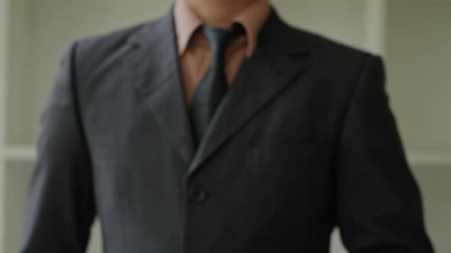 Gesture of Authority Business Professional Giving Direction in Office