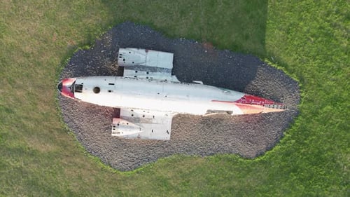 Aerial top-down view of the DC-3 airplane wreck in Eyvindarholt along the Ring Road in Iceland durin