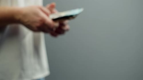 Hands exchanging Ukrainian hryvnia banknotes in close up