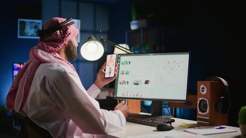 Adult at Desk in Dark Office on Video Call