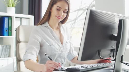 Young Woman Works at Office Using Computer Workplace of Entrepreneur Manager or Businesswoman Remote