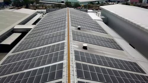 Aerial View of Solar Panel on Factory Roof
