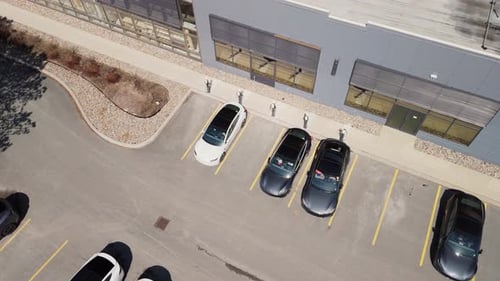 Top View Tesla Electric Cars are Charged in a Parking Lot in Dartmouth Canada