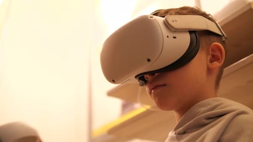 Child Plays Virtual Reality Video Game with Headset