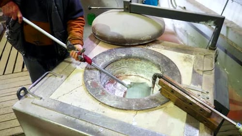 Melting Metal in Foundry With Ladle