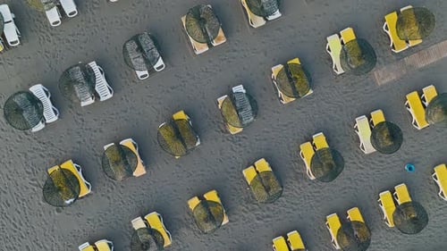 Aerial View Serene Beach Loungers Awaiting Your Arrival