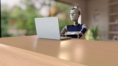 Humanoid Robot Typing on Laptop at Modern Desk