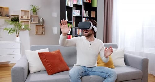 Man Wearing VR Headset Playing Video Game