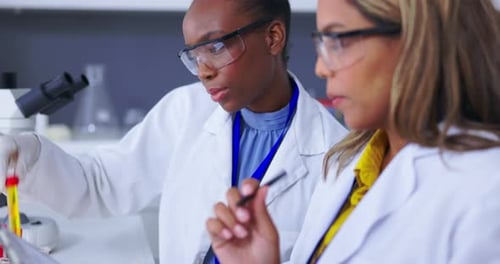 Scientists Collaborating on Research in Laboratory