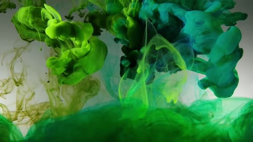 Colorful cloud swirls of olive green acrylic dye ink falling slowly into water, prismatic multi colo