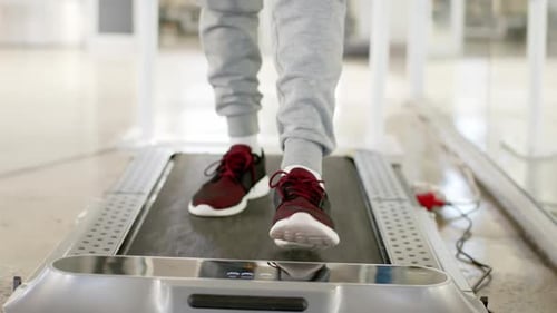 Person walking on treadmill for rehabilitation therapy