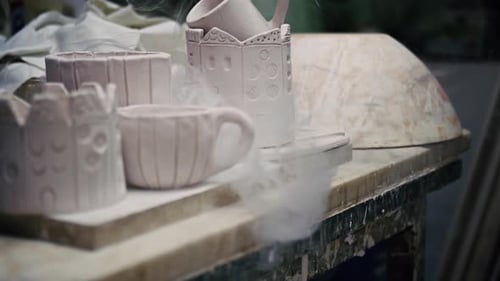 Cups And Vase In Ceramic Workshop