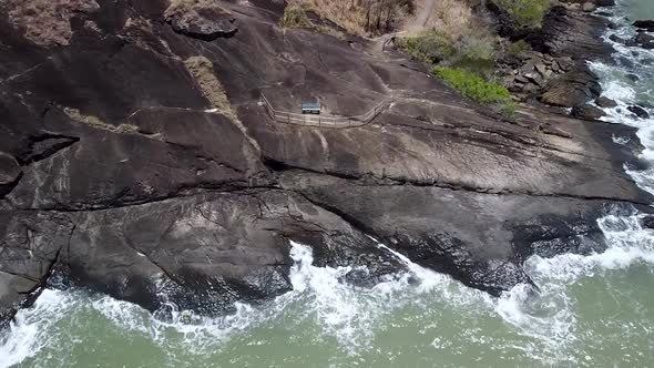 Aerial Of Waves Crashing Onto Rocks At Trinity Beach In Cairns. Follow ...