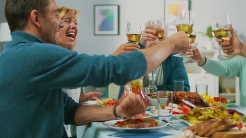 Family Celebration Meal with Toasts and Laughter