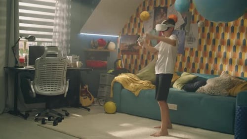 Boy Playing Virtual Reality Game in Bedroom