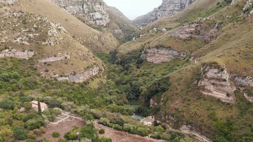 Cavagrande del Cassibile Canyon Nature Reserve With Stream And Lush Vegetation In Avola, Syracuse, I