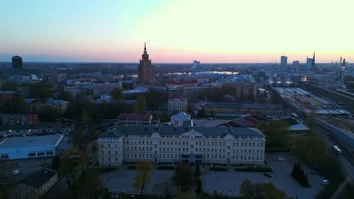Enjoy an Aerial View of the Urban City Skyline at Dusk with Distant Landmarks and Buildings in a