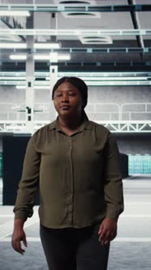 Vertical Video Portrait of Smiling Data Center Admin Conducting Security Audit