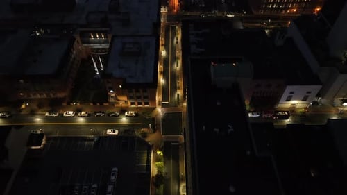 Aerial top down shot of illuminated Junction in american town. Quiet american downtown with warm Lig