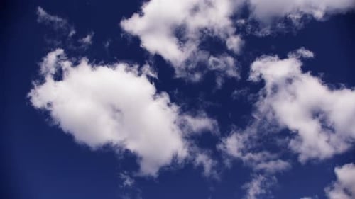 Puffy Clouds Against a Blue Sky