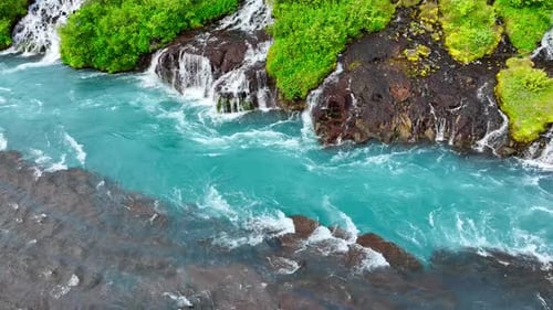 Waterfall in Summer Many Small Streams Flow From the Lava Field A River with the Purest Glacial